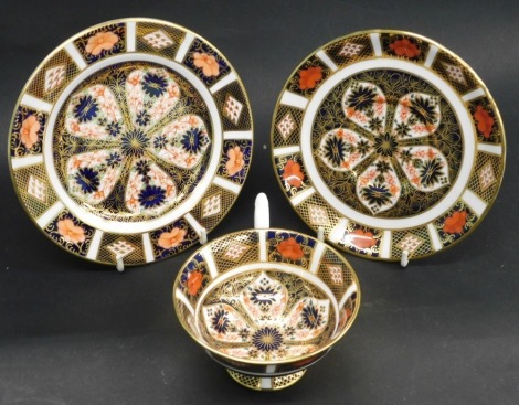 A Royal Crown Derby Imari pattern trio, comprising cup, saucer and side plate.