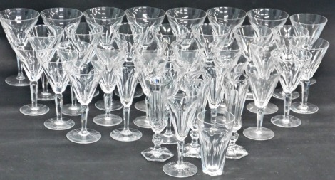 A suite of Art Deco style glasses, each with a facet cut tapering bowl, a faceted stem. (3 trays)