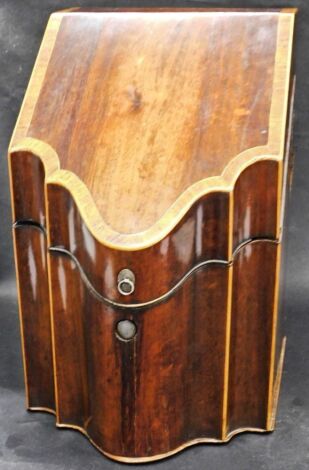 A George III mahogany knife box, the cross banded, hinged and sloping lid enclosing a fitted interior, 36cm high, 28cm deep, 23cm wide. (AF)