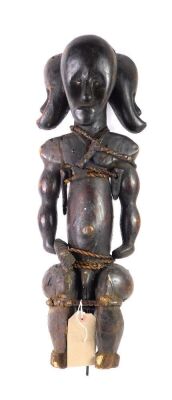 An African tribal Fang three headed reliquary figure, with rope bindings, associated metal mounting spike, Gabon circa 1935, 60cm high.