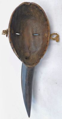 An African tribal Dan Maou Meditation mask, with stylised beak, Cote D'Ivoire circa 1980, 52cm long. - 2