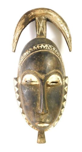 An African tribal Baule crescent mask, Cote D'Ivoire, circa 1965, 42cm high.