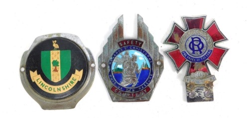 Three car badges, including a Order of the Road 40 Year Driver badge, a Saint Christopher badge, and a Lincolnshire car badge. (3)