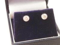 A pair of diamond stud earrings