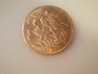 A George VI gold sovereign dated 1926.