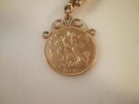 A Victorian gold sovereign dated 1887 with yellow metal mounts and yellow metal chain stamped 9ct