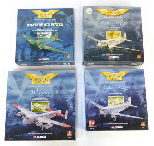 Four Corgi Aviation aircraft diecast models, 1:144 scale, comprising Berlin Airlift Douglas Dakota-RAF, Military Air Power Douglas EC-47P Skytrain, Berlin Aircraft Douglas C-47A Skytrain, and Avro Lancaster Royal Canadian Air Force, boxed.