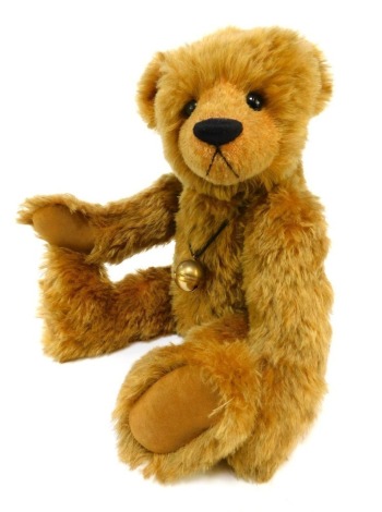 An Old Bexley Bears by Rosita Lynn mohair Teddy bear, caramel colouring, jointed, with bell necklace, 48cm high overall.