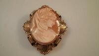 An oval shell cameo brooch in a 9ct gold frame