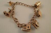 A 9ct gold charm bracelet with six attached charms