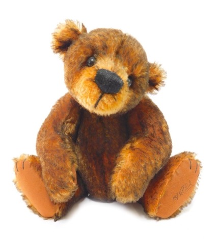 A mohair Teddy bear designed exclusively for The Cliff Richard Organisation, by Susan Johnson for Gund, named Wingnut, number 44805, 26cm high overall.