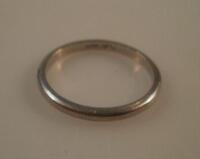 A wedding band marked platinum