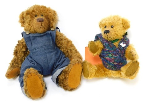 Two mohair Teddy bears, comprising a Rainbow Bears Teddy bear made by Judith Blythe, named William, wearing denim dungarees, 28cm high, together with another called Joey, wearing a knitted vest, 24cm high.