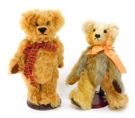 Two mohair Teddy bears, comprising a Valentine Bears by Jane Davis Bear, mottled grey and caramel wearing coral coloured ribbon, 29cm high, on stand, together with a Yesterday's Bear by Linda Stevens mohair bear named Toffee, 30cm high, on stand.