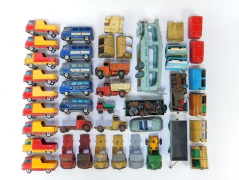 A group of diecast vehicles, play worn, to include Corgi Commer three quarter tonne chassis, a Dinky Pullmore car transporter, Corgi County police vans, car parts, etc. (1 tray)