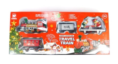 A Happy Departure Travel train set, Christmas themed, battery operated, in box.