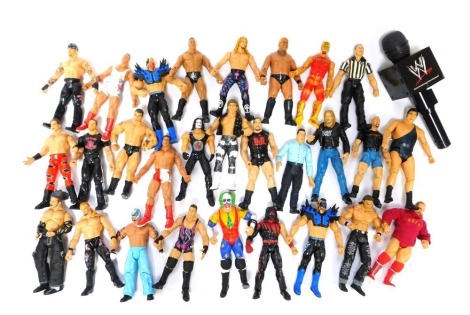 A group of WWE and other plastic figures, to include Titantron set, etc.