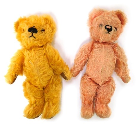 Two mid century Chad Valley Teddy bears, in yellow and pink, jointed, with fabric label to each foot, 33cm high.