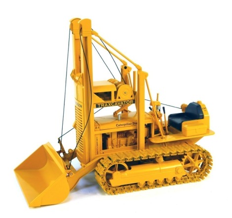 A Caterpillar D2 track type diecast tractor, 5U series Traxcavator, offered exclusively by Antique Caterpillar Machinery Owners Club, 1:16 scale, boxed.