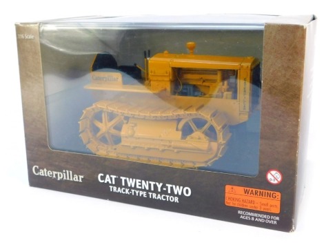 A Caterpillar Cat Twenty-Two track type diecast tractor, 1:16 scale, boxed.