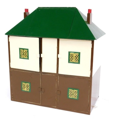 A painted wooden two storey dolls house, in brown and cream, with green roof with lift up section to enclose loft space, with some furniture, 75cm high.