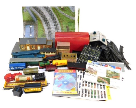 A quantity of OO gauge track, carriages, rolling stock, buildings, etc. (3 boxes)