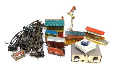 A group of O gauge railway track, tin plate buildings, together with a Hornby No. 1 Goods van, a Gauge Master electronic loco controller, etc. (2 trays)