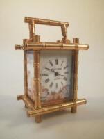 A modern miniature carriage clock by Elliot and Sons London