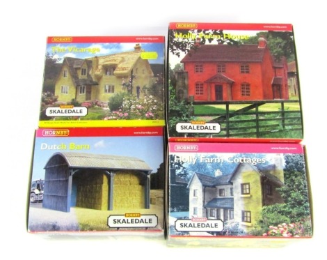 Four Hornby Skaledale OO gauge model buildings, comprising The Vicarage, Dutch Barn, Holly Farm House and Holly Farm Cottages, boxed.