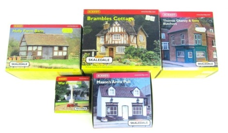 Five Hornby OO gauge Skaledale model buildings, comprising Brambles Cottage, Thomas Chaney and Sons Butchers, Masons Arms Pub, Holly Farm Barn and War Memorial, boxed.