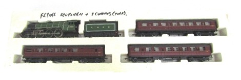 A Hornby OO gauge Flying Scotman's locomotive and tender, 4-6-0, 4472, green livery, L5502, together with three coaches.