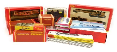 A group of Hornby and other OO gauge accessories, to include a Hornby Country Station, R279 mock Georgian house, platform canopies, car carrier, etc.