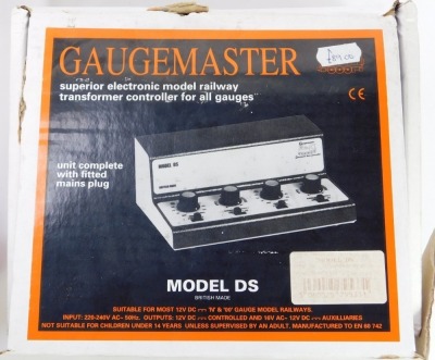 A Gaugemaster model DS electronic model railway transformer controller, together with two Tri-ang power units, etc. - 4