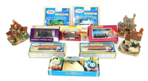 A group of OO gauge rolling stock, to include Hornby Super Detail first rolling stock, Clee Hill four plank wagon, R131, Thomas and Friends rolling stock, together with three Country Collection resin model houses.