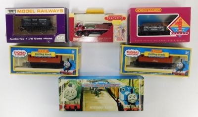 A group of OO gauge rolling stock, to include Hornby Super Detail first rolling stock, Clee Hill four plank wagon, R131, Thomas and Friends rolling stock, together with three Country Collection resin model houses. - 4