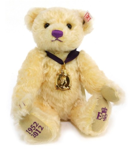 A Steiff Diamond Jubilee Teddy bear, No 2800, in vanilla, made exclusively for Danbury Mint, 27cm high, boxed with certificate.