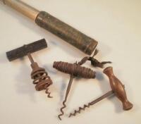 A late 19thC brass miniature telescope and three corkscrews.