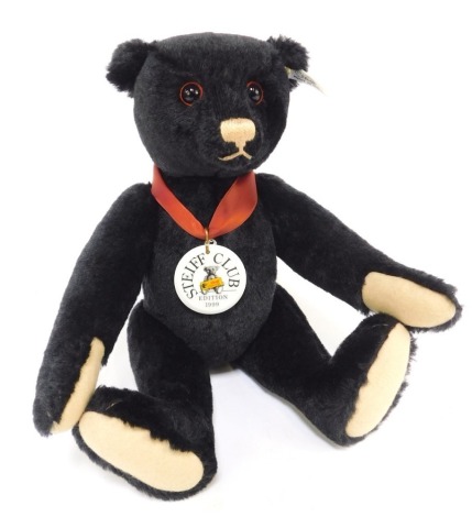 A Steiff mohair growler Teddy Bear 1912, in black, 35, limited edition No 8929, 35cm high, boxed with certificate.