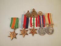 A set of WWII service medals awarded to Mr H Clarke