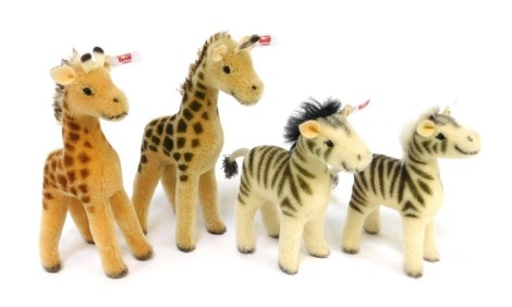 Steiff Noah's Ark mohair Set Two figures, comprising male and female giraffe, 21cm and 20cm high, and male and female zebra, 15cm and 14cm high, with certificate.