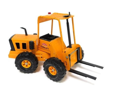 A Tonka tinplate forklift, in orange, 31cm high.