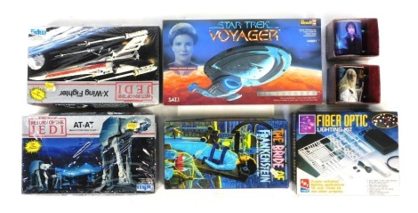 Various model kits, including Star Trek Voyager USS Voyager, Star Wars Return of the Jedi X Wing Fighter, Star Wars Return of the Jedi ATAT, AMT Ertl fibre optic lighting kit, The Bride of Frankenstein model kit, and two Lord of the Rings mugs Gandalf and