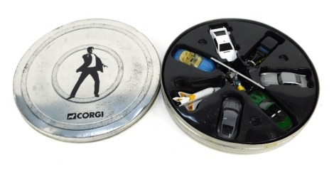 A Corgi diecast James Bond set, including Aston Martin Jaguar XKR, Aston Martin DB5, Aston Martin DBS, Lotus Esprit, BMW Z3, Gold Finger's 1937 Rolls Royce, Moonraker space shuttle, and gyrocopter Little Nellie, contained in film tin.