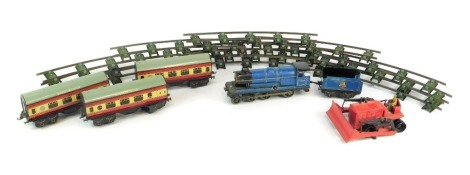 An O gauge clockwork train set, including 4-4-0 locomotive in BR blue, three crimson and cream Flying Scotsman coaches and track, and a Dinky Supertoys Blaw Knox bulldozer. (1 tray)