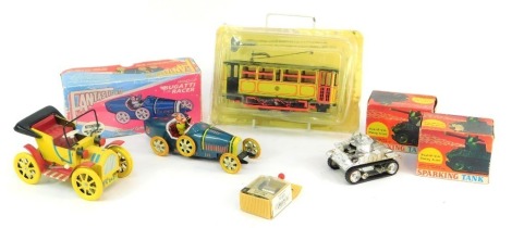 Reproduction tinplate clockwork vehicles, including Fantastic and Co T35 Bugatti Racer, clockwork sparking tank, clockwork trolley bus, and a yellow clockwork car. (a quantity)