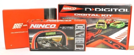 Ninco N Digital slot car racing, comprising a Ninco N Digital conversion kit, Ninco 10th Anniversary Collectors Set, including a Renault Clio 16 valve, and a Ninco N Scorer wireless lap counter, boxed. (3)