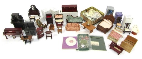 Dolls house furniture, to include mahogany effect pianola, rocking chairs, sofas, chaise longue, stove, upholstery, etc, boxed and unboxed. (1 box)