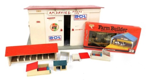 A painted plywood scratch build farm garage, farm stables, Britains pig pens, sheds, and a Britains farm builder cattle shed. (a quantity)