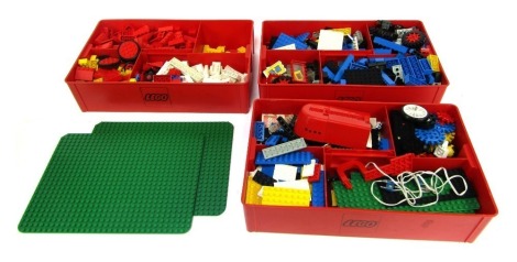 Various Lego, including base boards, figures, gears, wheels, contained in three Lego Tote boxes. (3)