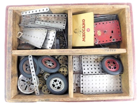 Meccano, including flexible plates, strip plates, triangle flexible plates, nuts and bolts, gears, etc., in a fitted box.